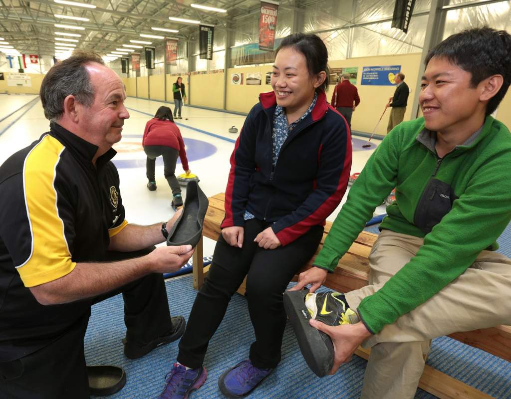 Curling in Naseby fitting safe shoe covers for on the ice