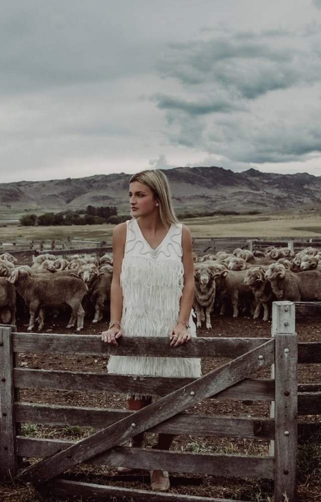 woolon Event Fashion Garments  white dress in sheep yards Photographer Lisa Davidson
